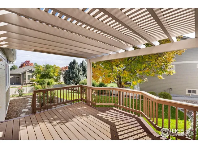a view of a balcony with wooden floor