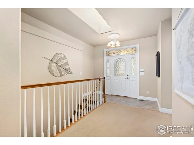 a view of a hallway and wooden floor