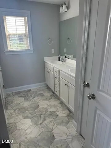a bathroom with a sink toilet and vanity