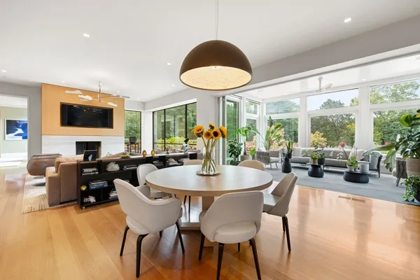 a dining room with furniture garden view and a large window