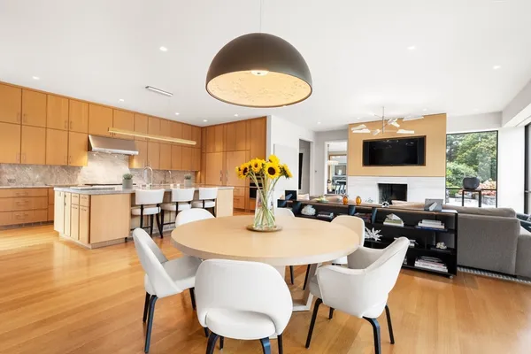 a view of a dining room with furniture window and wooden floor