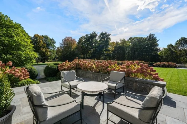 a view of a chairs and table in patio