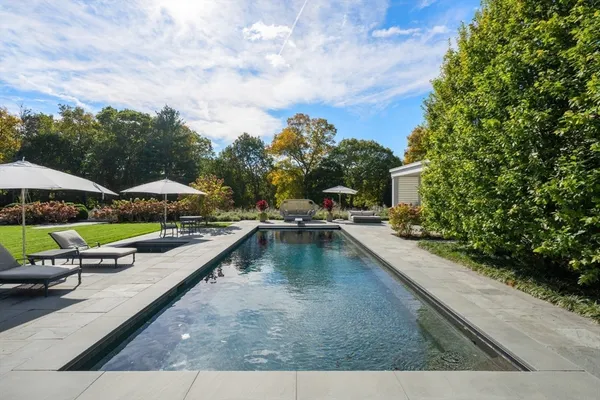 a view of swimming pool with chairs