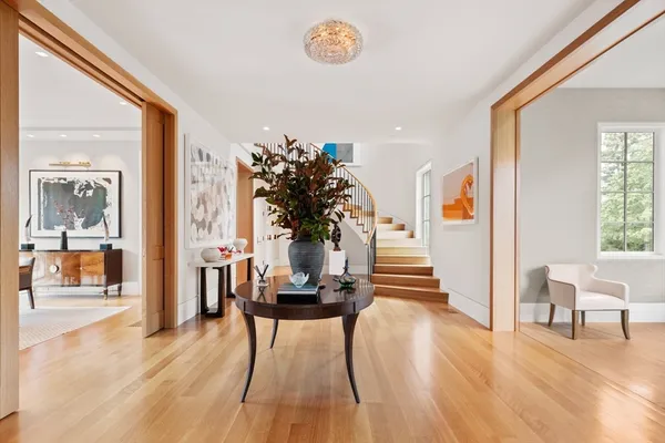 a dining room with furniture and wooden floor