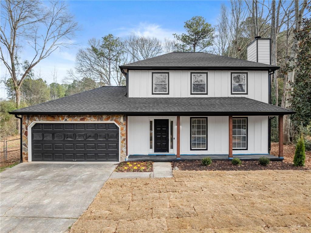 604 Fox Run Winder, GA 30680 - Photo 1 of 38 a front view of a house with a yard and garage