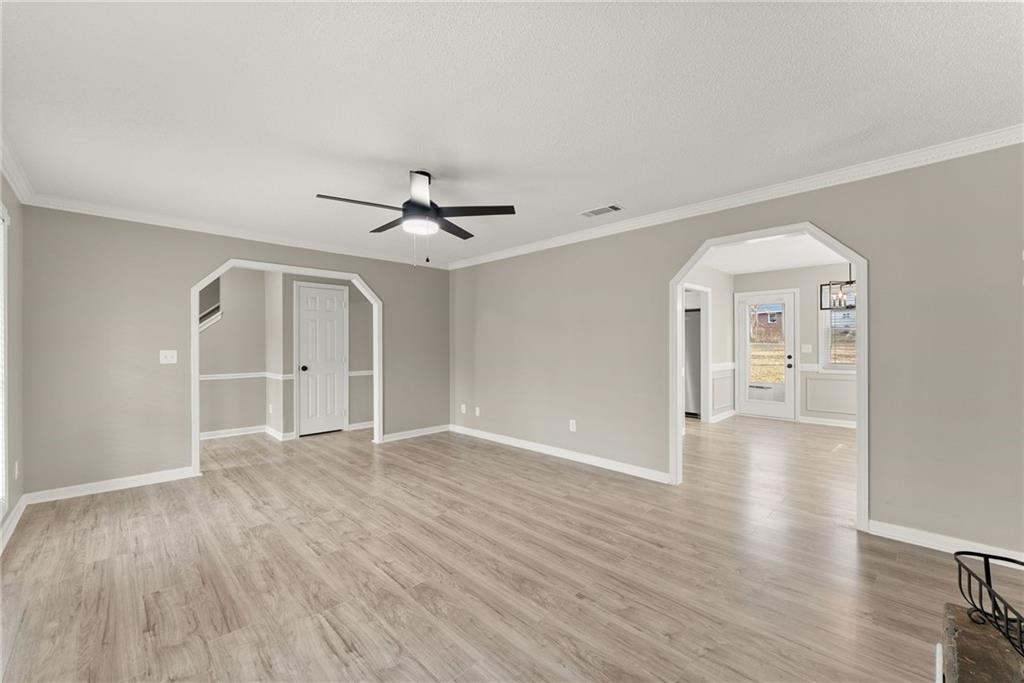 604 Fox Run Winder, GA 30680 - Photo 11 of 38 a view of a livingroom with wooden floor and a ceiling fan