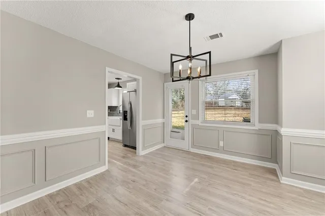 a open kitchen with window and refrigerator