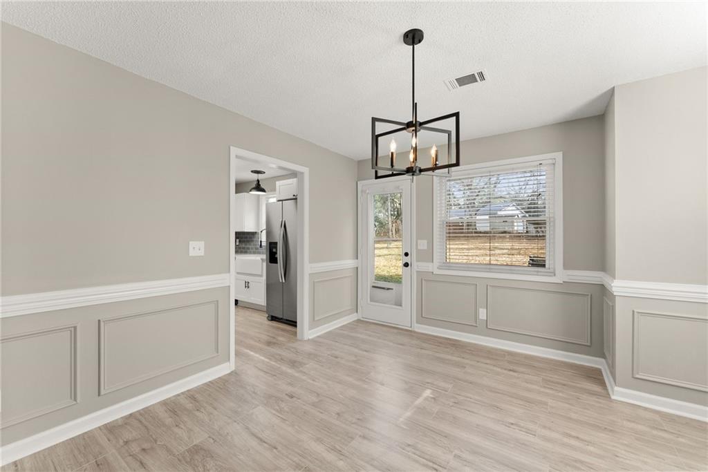 604 Fox Run Winder, GA 30680 - Photo 12 of 38 a open kitchen with window and refrigerator
