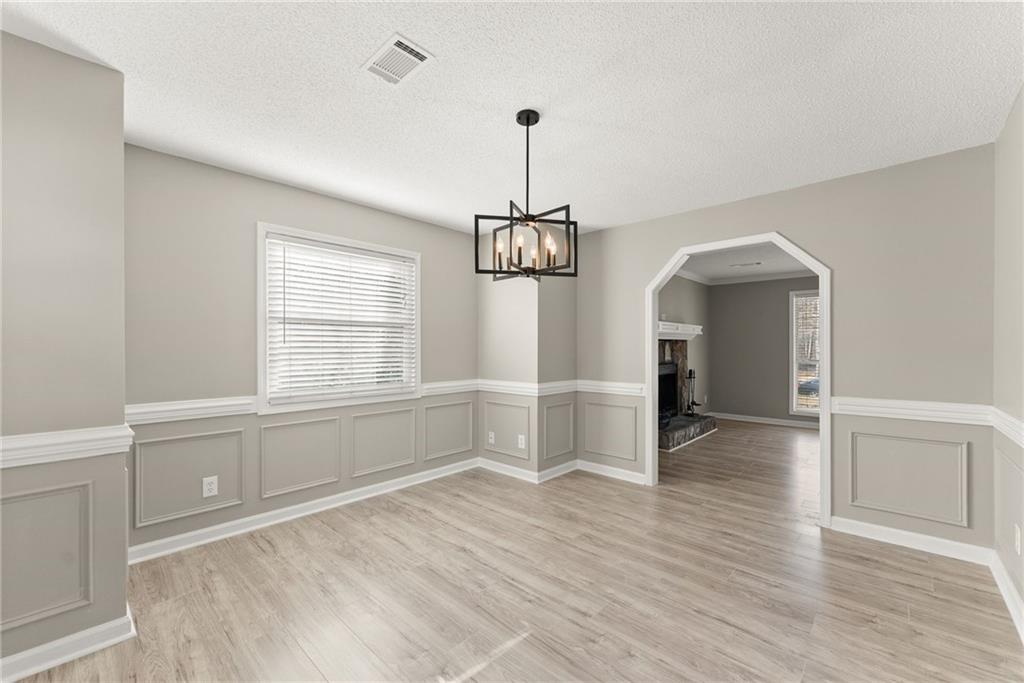 604 Fox Run Winder, GA 30680 - Photo 13 of 38 wooden floor in an empty room with a window