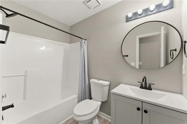 a white toilet sitting next to a bathroom sink