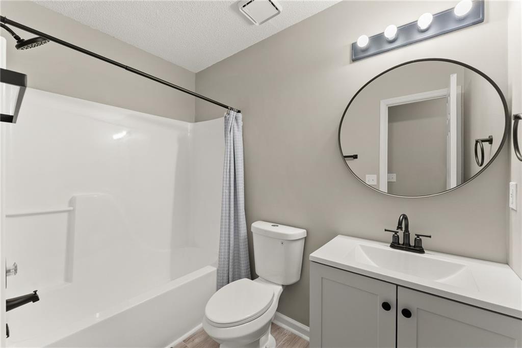 604 Fox Run Winder, GA 30680 - Photo 21 of 38 a white toilet sitting next to a bathroom sink
