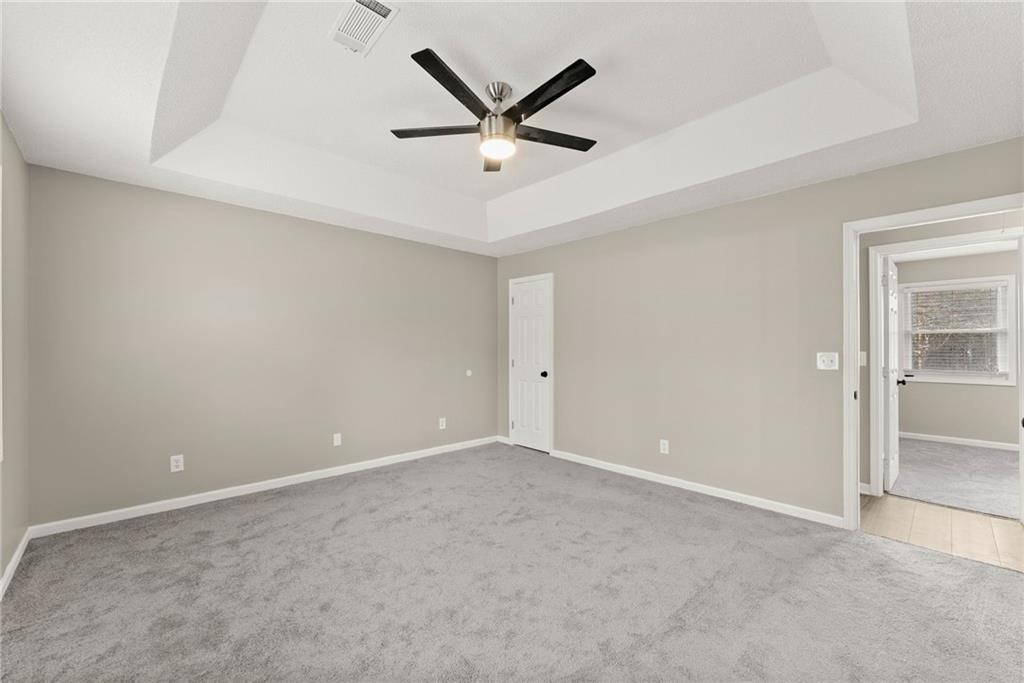 604 Fox Run Winder, GA 30680 - Photo 27 of 38 an empty room with closet and ceiling fan