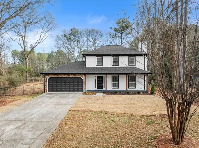 a front view of a house with yard