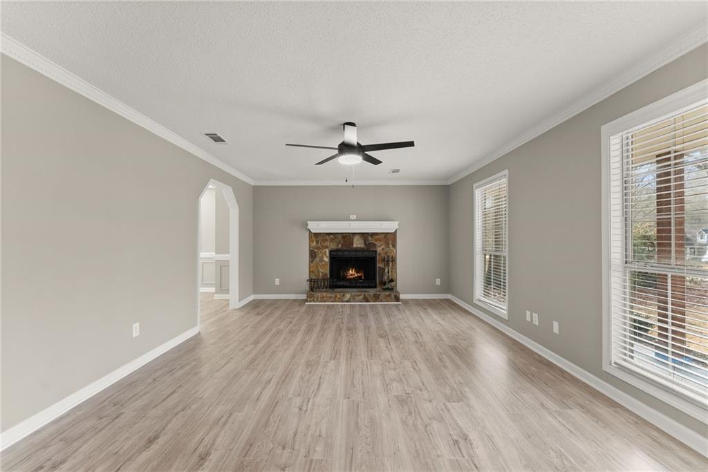 604 Fox Run Winder, GA 30680 - Photo 8 of 38 wooden floor in an empty room with a window