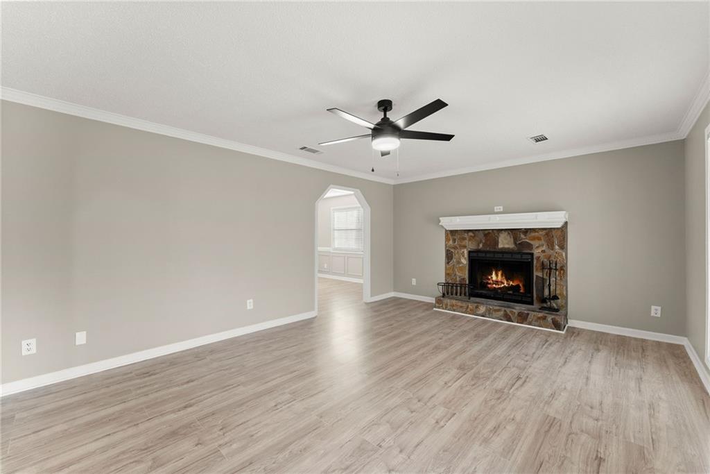 604 Fox Run Winder, GA 30680 - Photo 9 of 38 an empty room with windows a fireplace