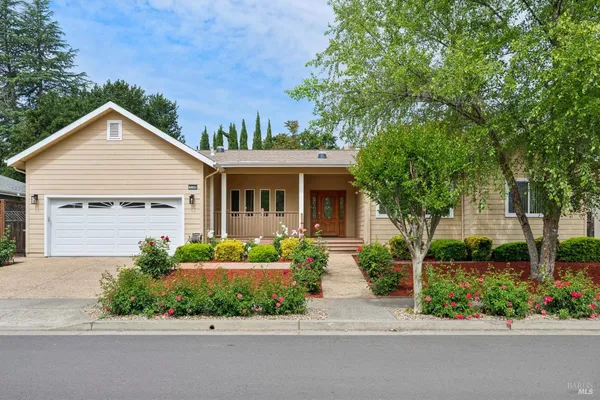 front view of a house with a small yard
