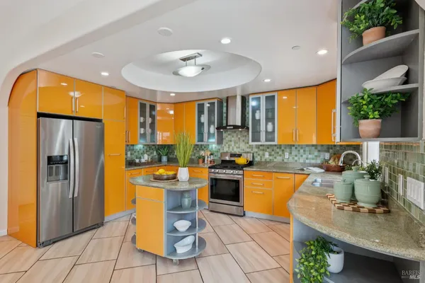 a kitchen with a sink a counter top space and appliances