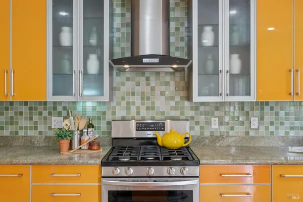 a kitchen with a stove and a sink
