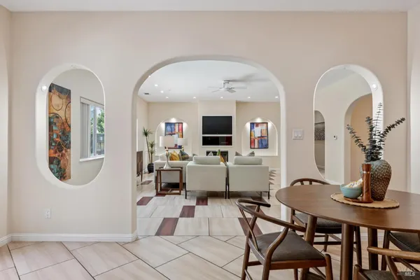 a view of a livingroom with furniture and a mirror
