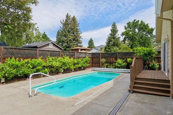 a view of a swimming pool with a patio