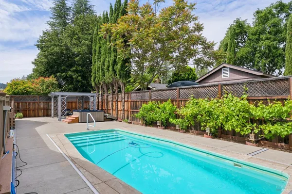 a view of a backyard with sitting area