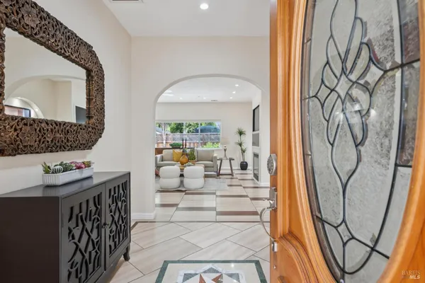 a view of an entryway with wooden floor