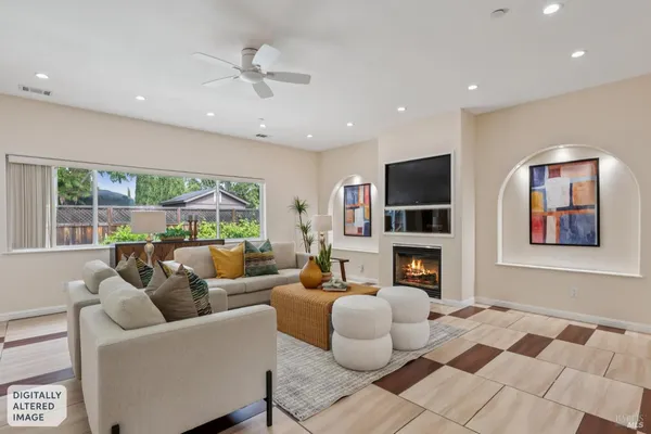 a living room with furniture fireplace and flat screen tv