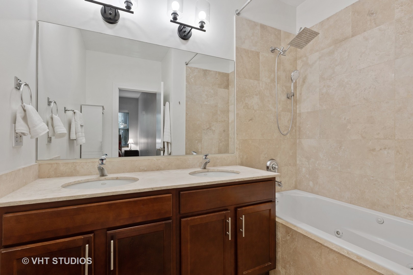 1520 West Addison Street, Unit 1 Chicago, IL 60613 - Photo 7 of 12 a bathroom with a sink and a mirror