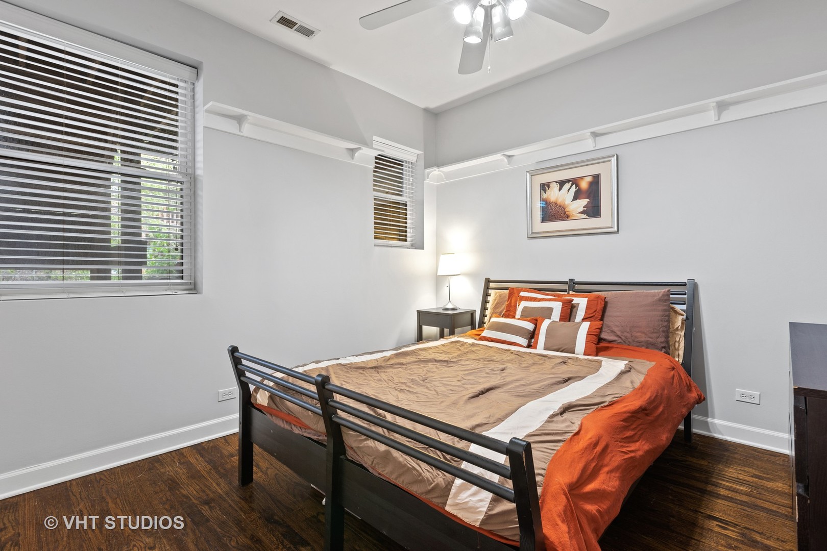 1520 West Addison Street, Unit 1 Chicago, IL 60613 - Photo 8 of 12 a bedroom with a bed and a table in it