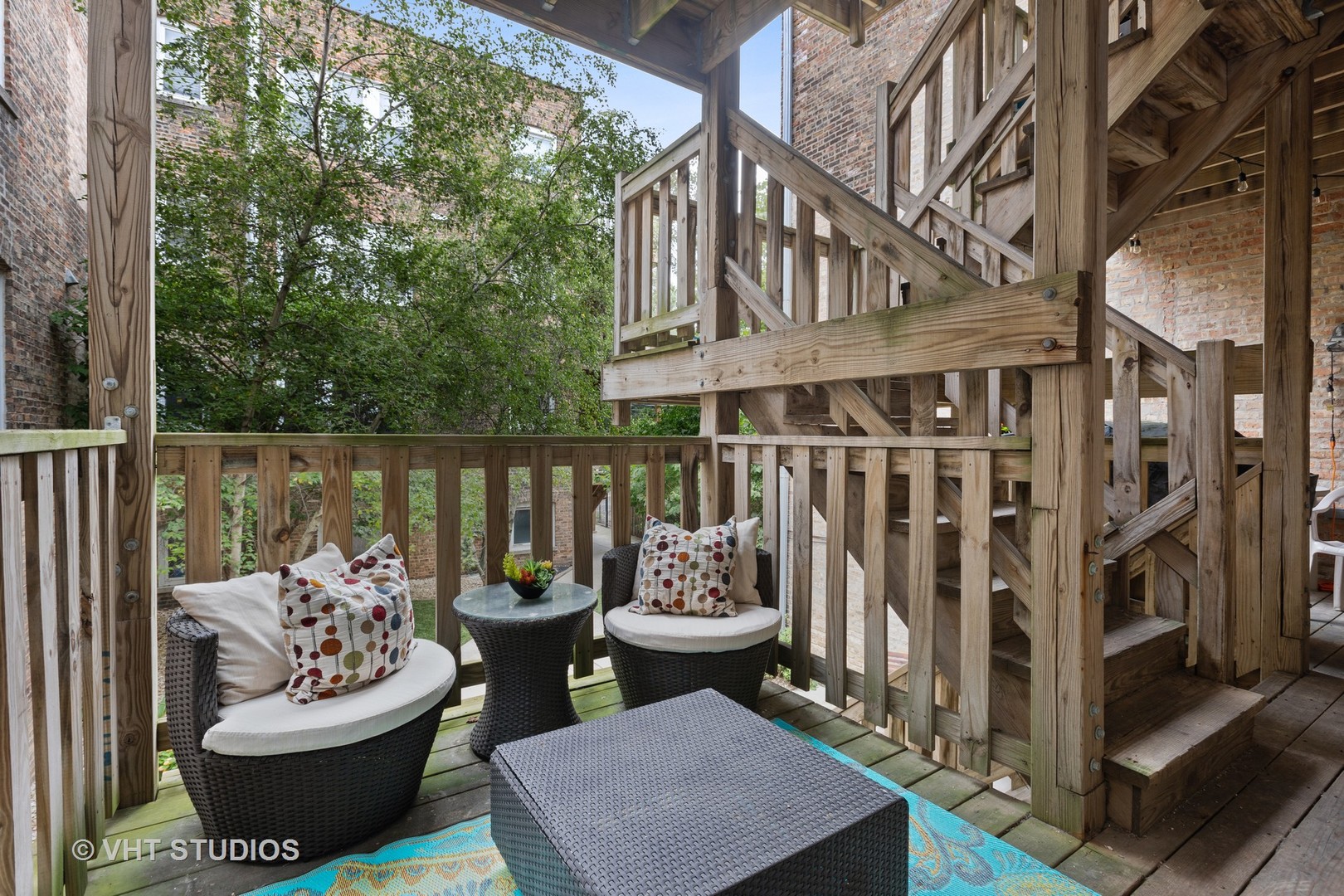 1520 West Addison Street, Unit 1 Chicago, IL 60613 - Photo 10 of 12 a view of a patio with a table and chairs and a fire pit