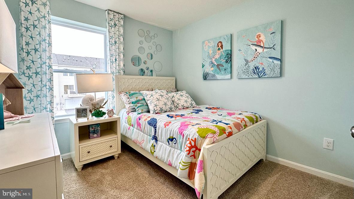 1509 Avon Way Salisbury, MD 21801 - Photo 18 of 27 a bedroom with a bed and a painting on the wall