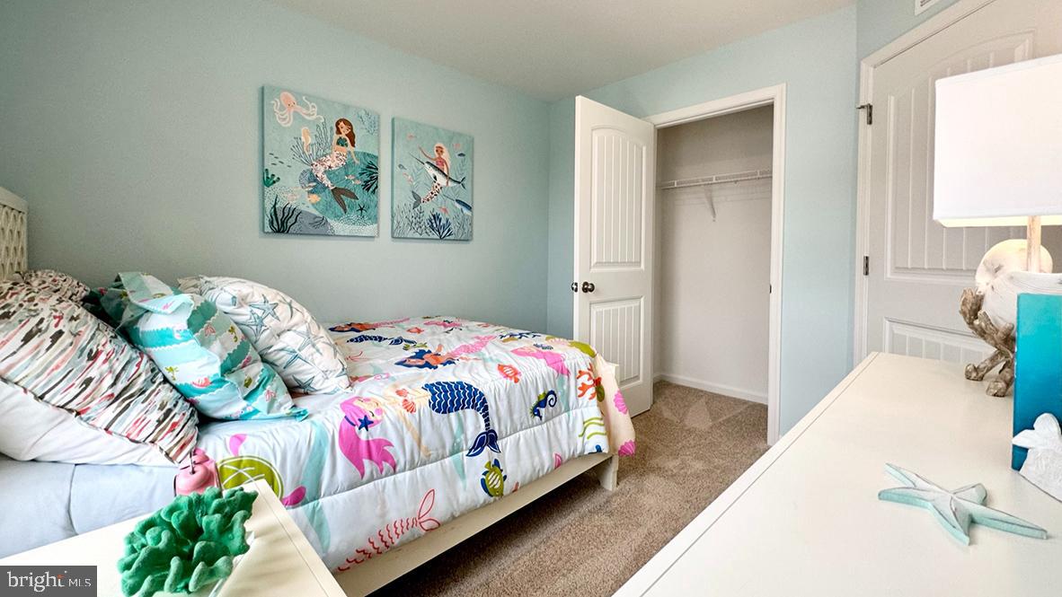 1509 Avon Way Salisbury, MD 21801 - Photo 19 of 27 a bedroom with bed and painting on the wall