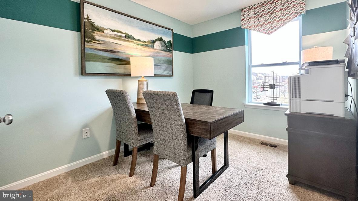 1509 Avon Way Salisbury, MD 21801 - Photo 20 of 27 a view of a dining room with furniture and a large window