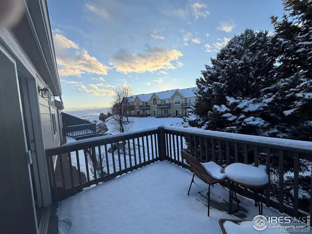 a view of a two chairs in the balcony