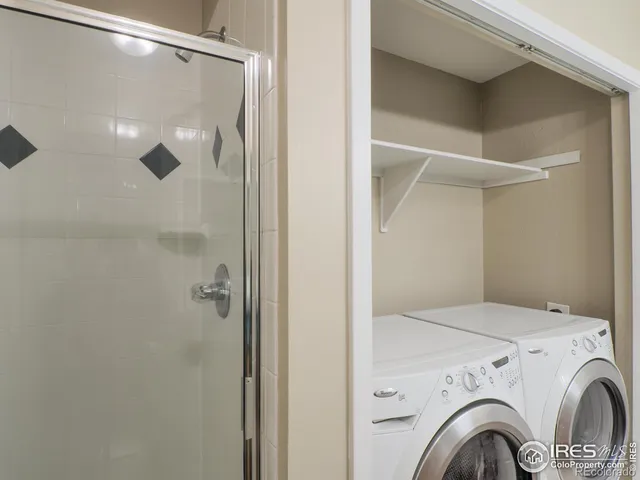 a view of bathroom with washer and dryer