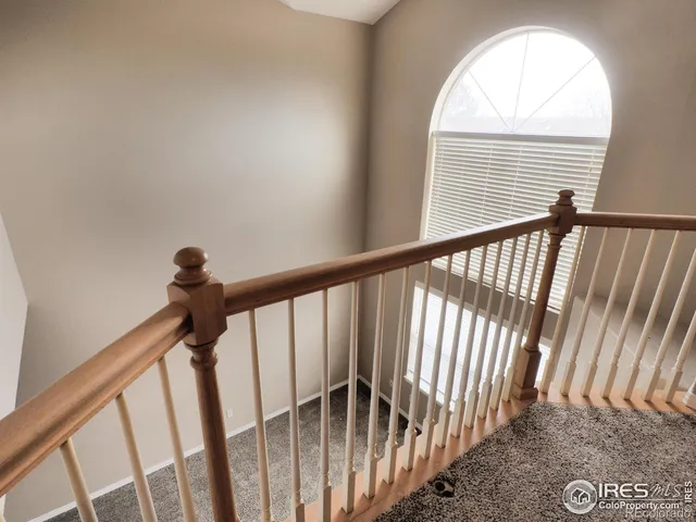 a view of staircase with empty racks