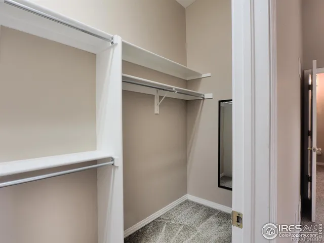 a room with a cabinets and toilet