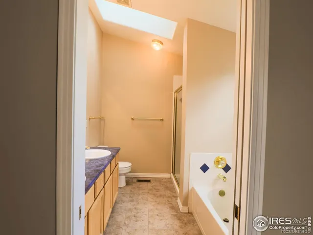 a bathroom with bathtub and shower