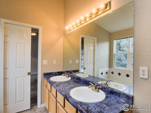 a balcony with wooden floor and fence