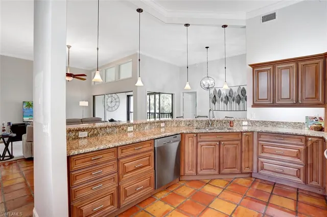 a kitchen with a sink stove and cabinets