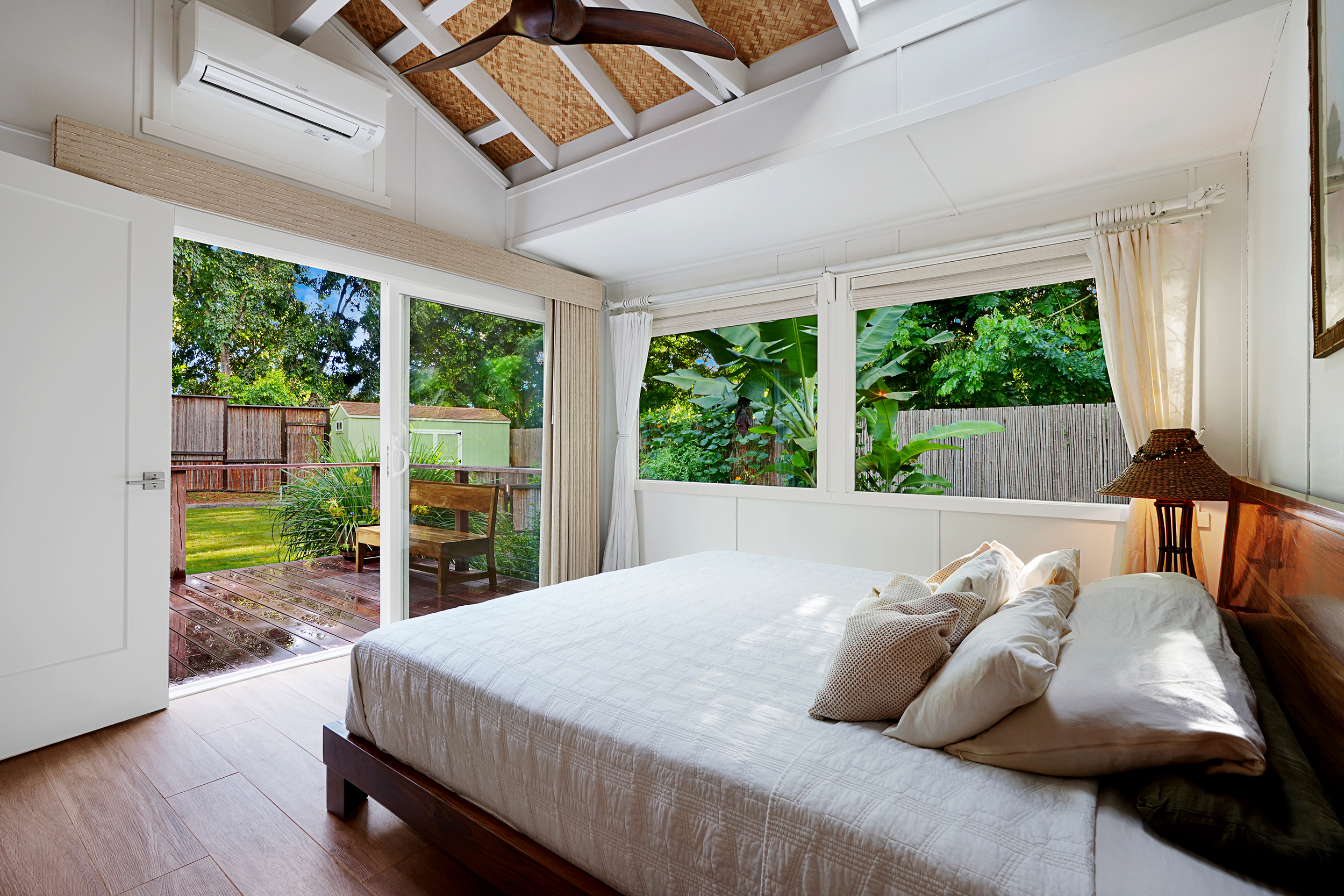 3720A Moloaa Road Kapaa, HI 96746 - Photo 9 of 17 a bed sitting in a bedroom next to a window