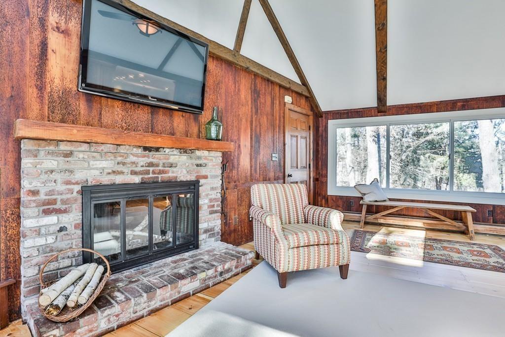 13 Sheffield Road Boxford, MA 01921 - Photo 11 of 41 a living room with furniture and a fireplace
