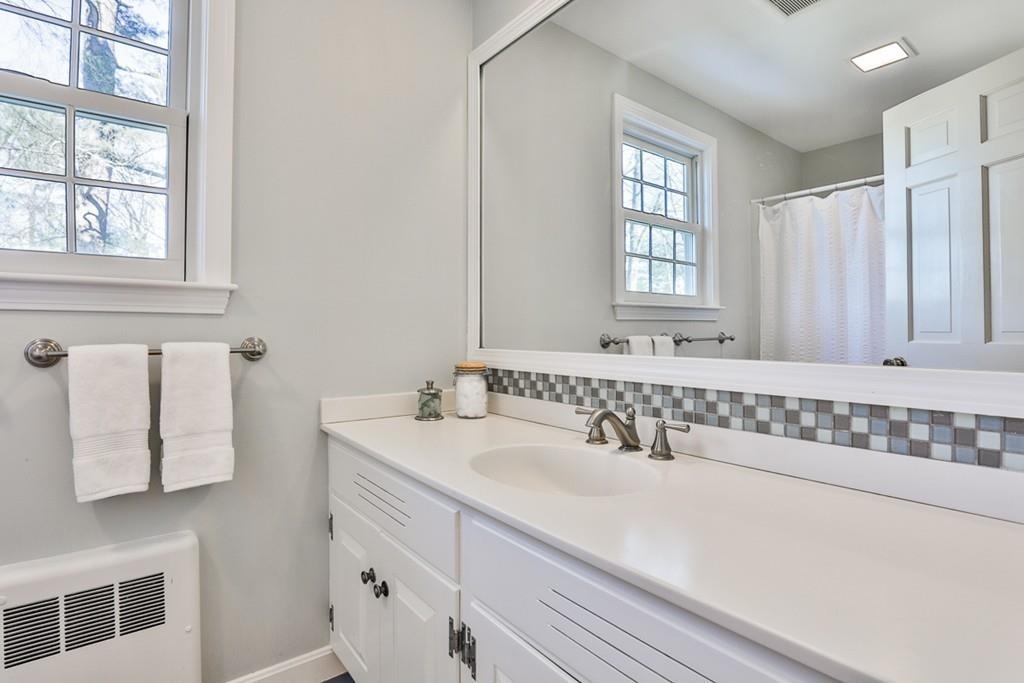 13 Sheffield Road Boxford, MA 01921 - Photo 28 of 41 a bathroom with a sink and a mirror