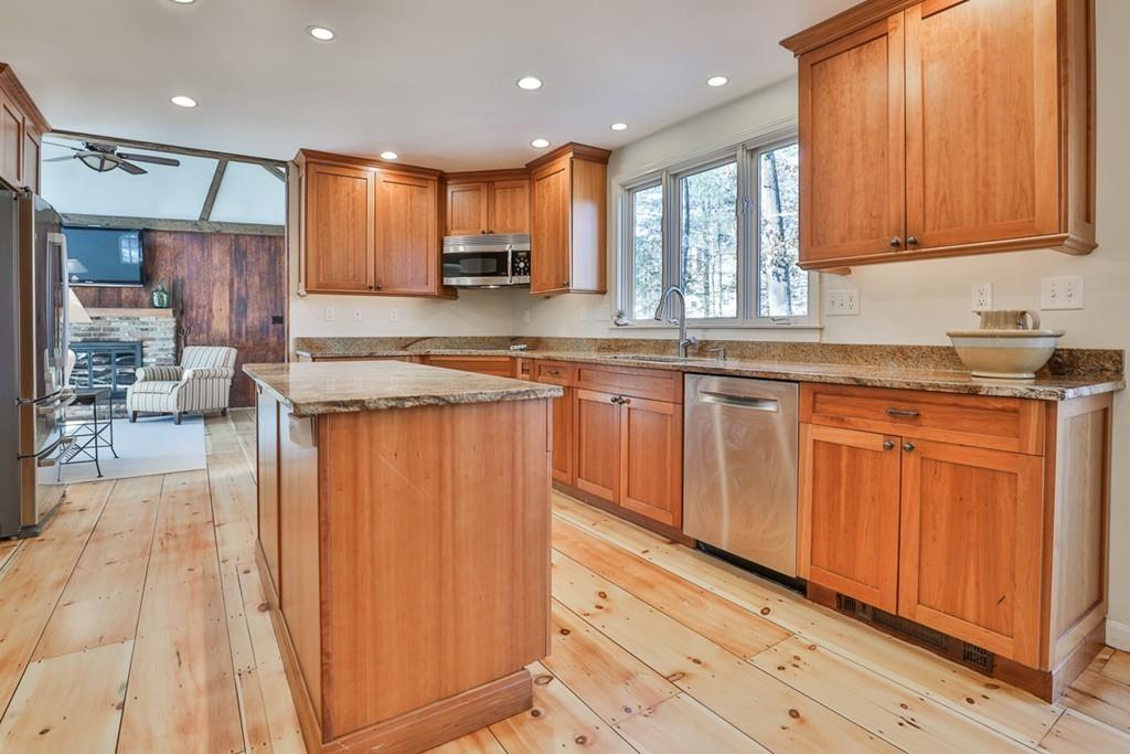 13 Sheffield Road Boxford, MA 01921 - Photo 4 of 41 a kitchen with stainless steel appliances granite countertop a stove a sink and a refrigerator
