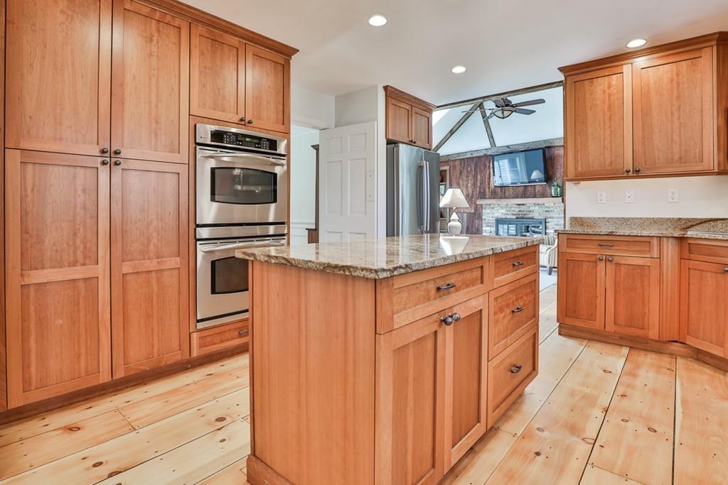 13 Sheffield Road Boxford, MA 01921 - Photo 8 of 41 a kitchen with stainless steel appliances granite countertop a refrigerator and a stove top oven