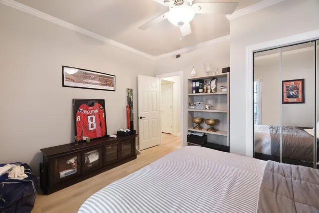 a bedroom with a bed and a television