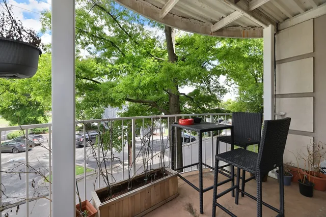 a view of a chairs and table in the patio