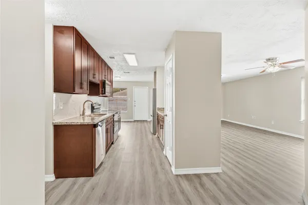 a view of a kitchen from the hallway