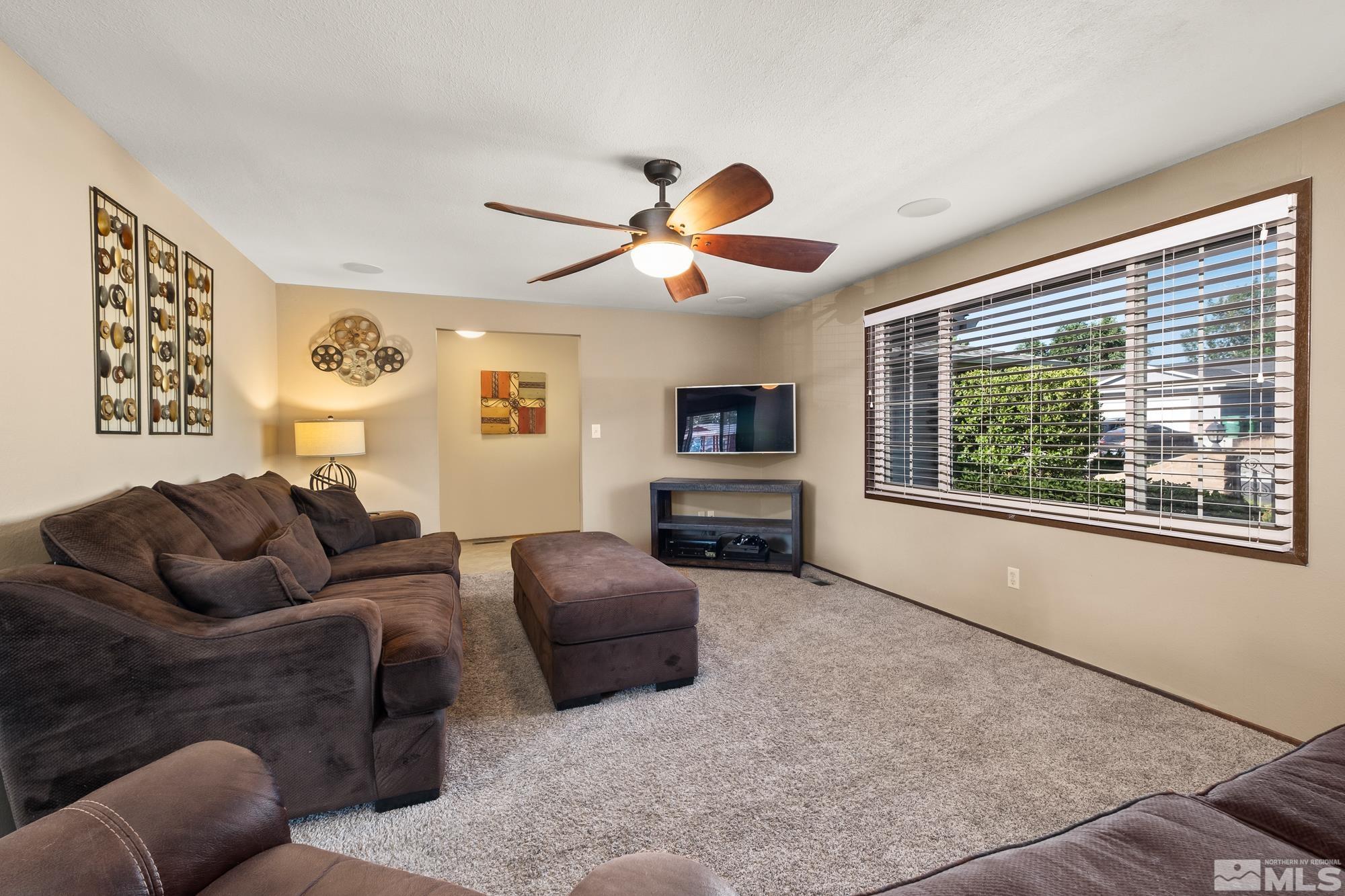 560 Peter Reno, NV 89503 - Photo 12 of 21 a living room with furniture a window and a flat screen tv