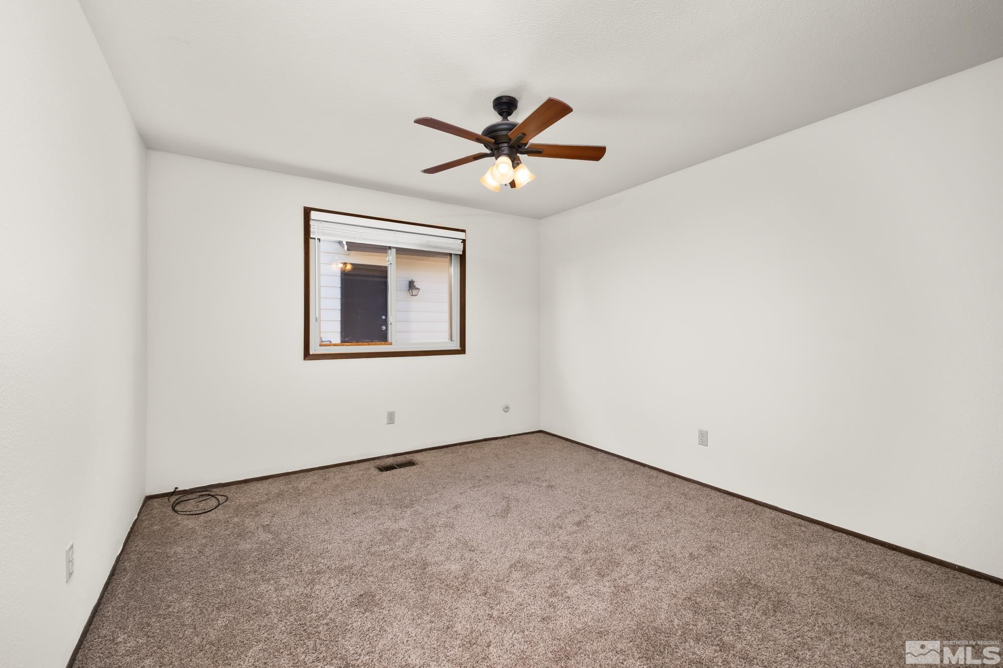 560 Peter Reno, NV 89503 - Photo 17 of 21 an empty room with a window and a ceiling fan